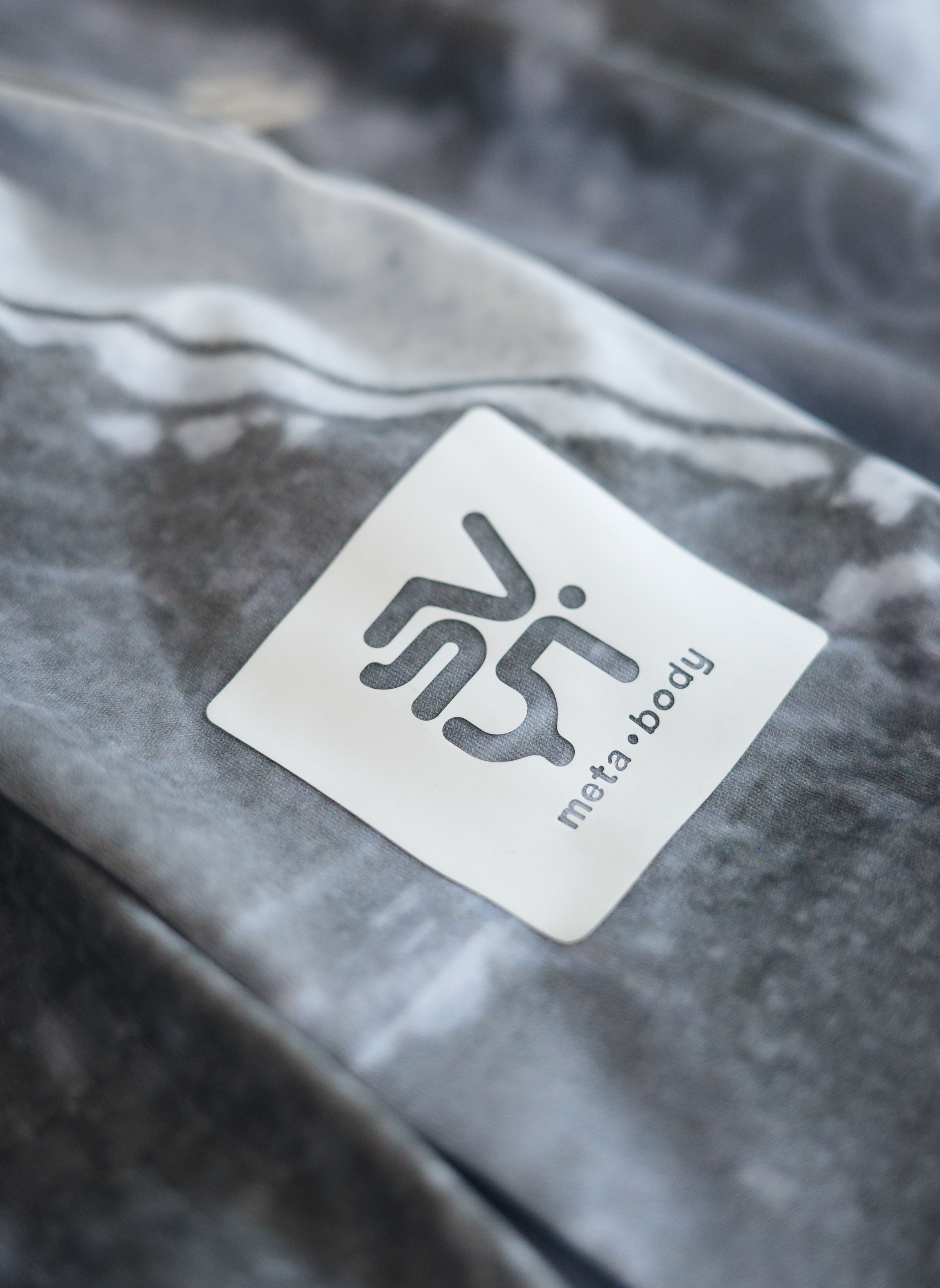 Close-up of a label on a textured surface with 'SVYT' branding.